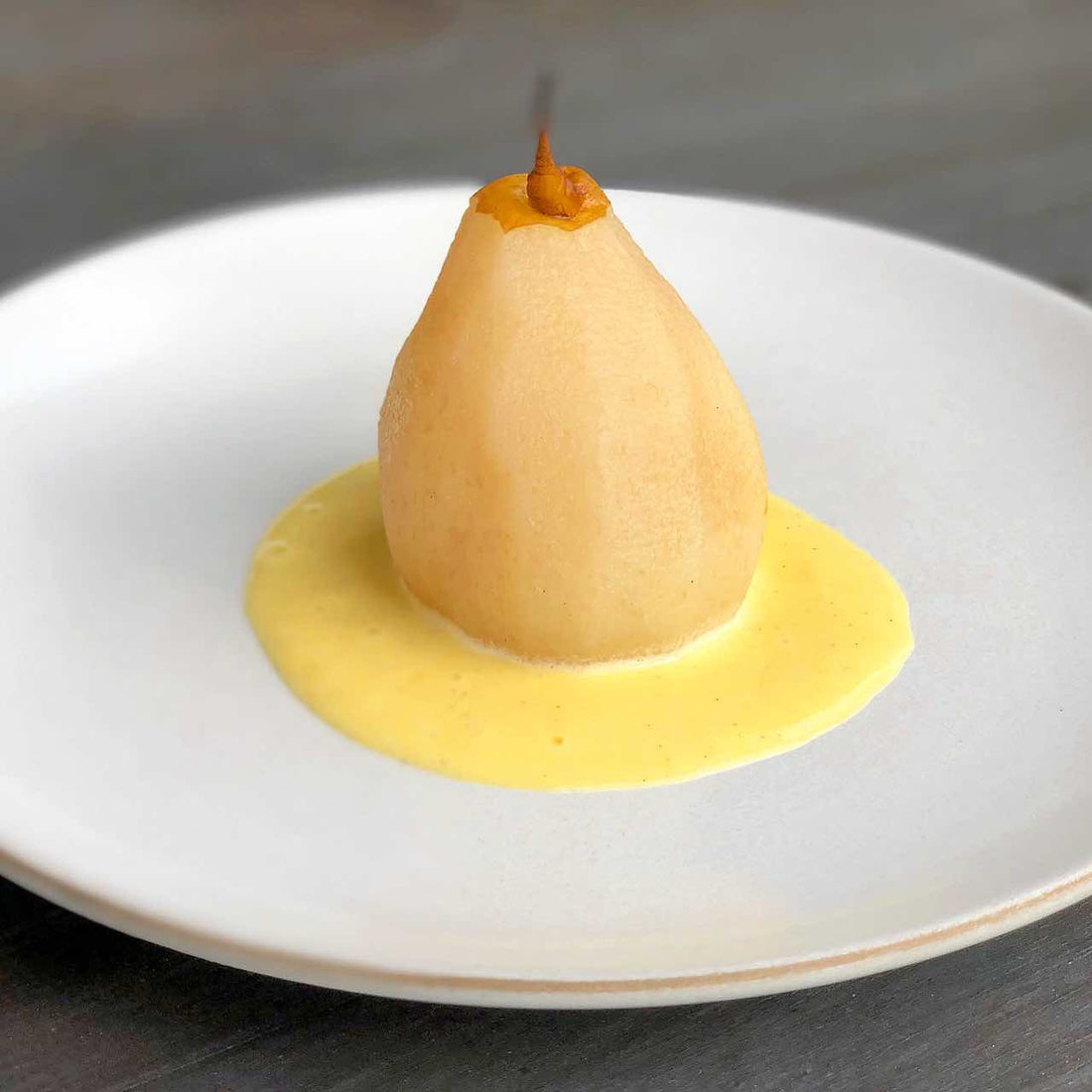 Poached pear with creme anglaise